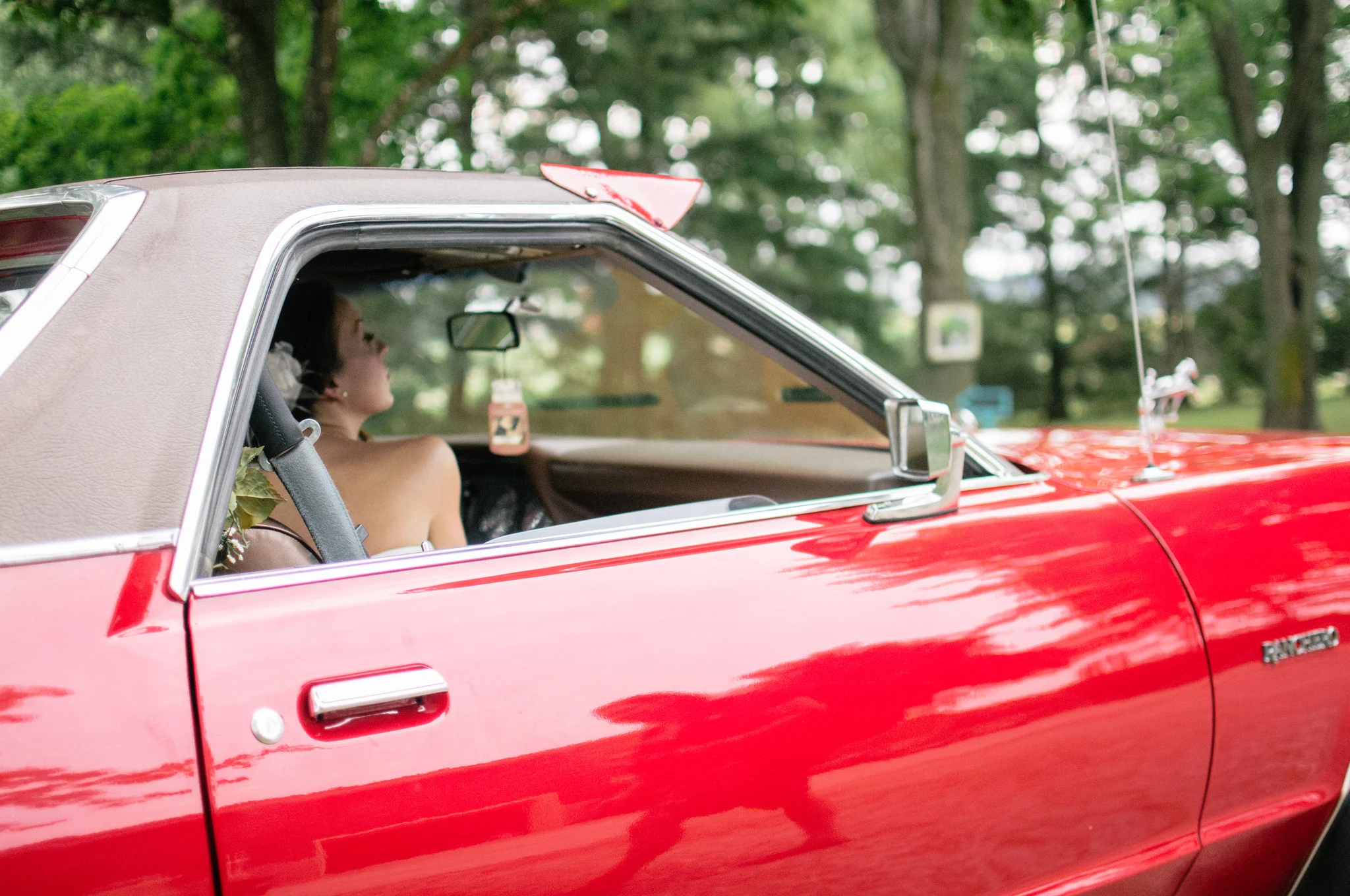 Red vintage car with a driver