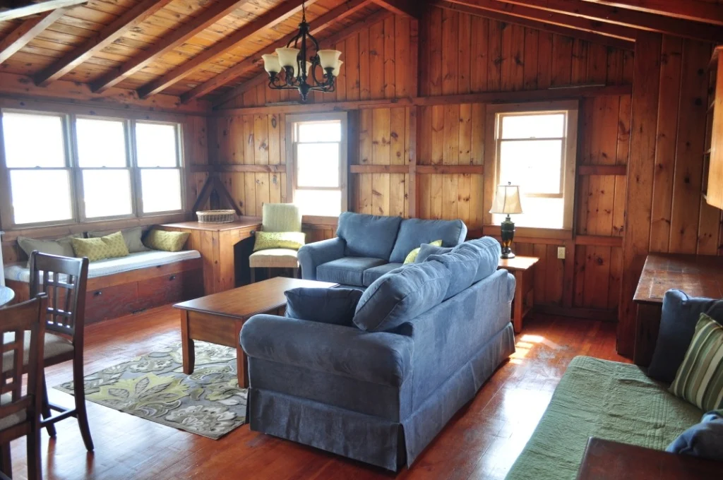 Wood-paneled cottage living room