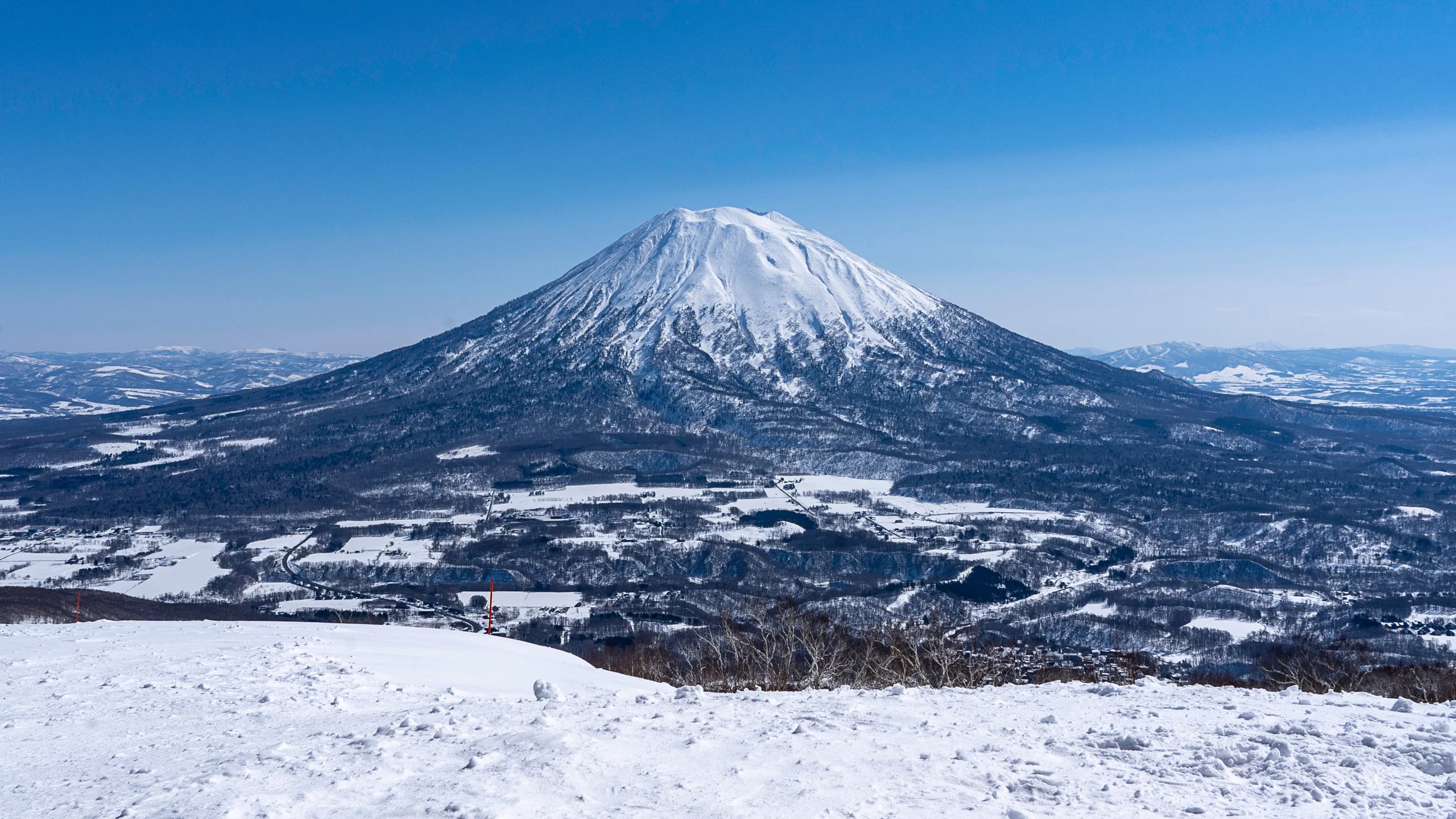 Snowy Mount Yotei viewed from a Hokkaido ski slope